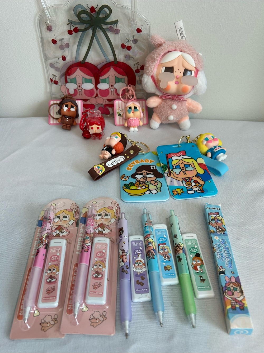 Crybaby plush, pens, pencils, ID badges and key chains